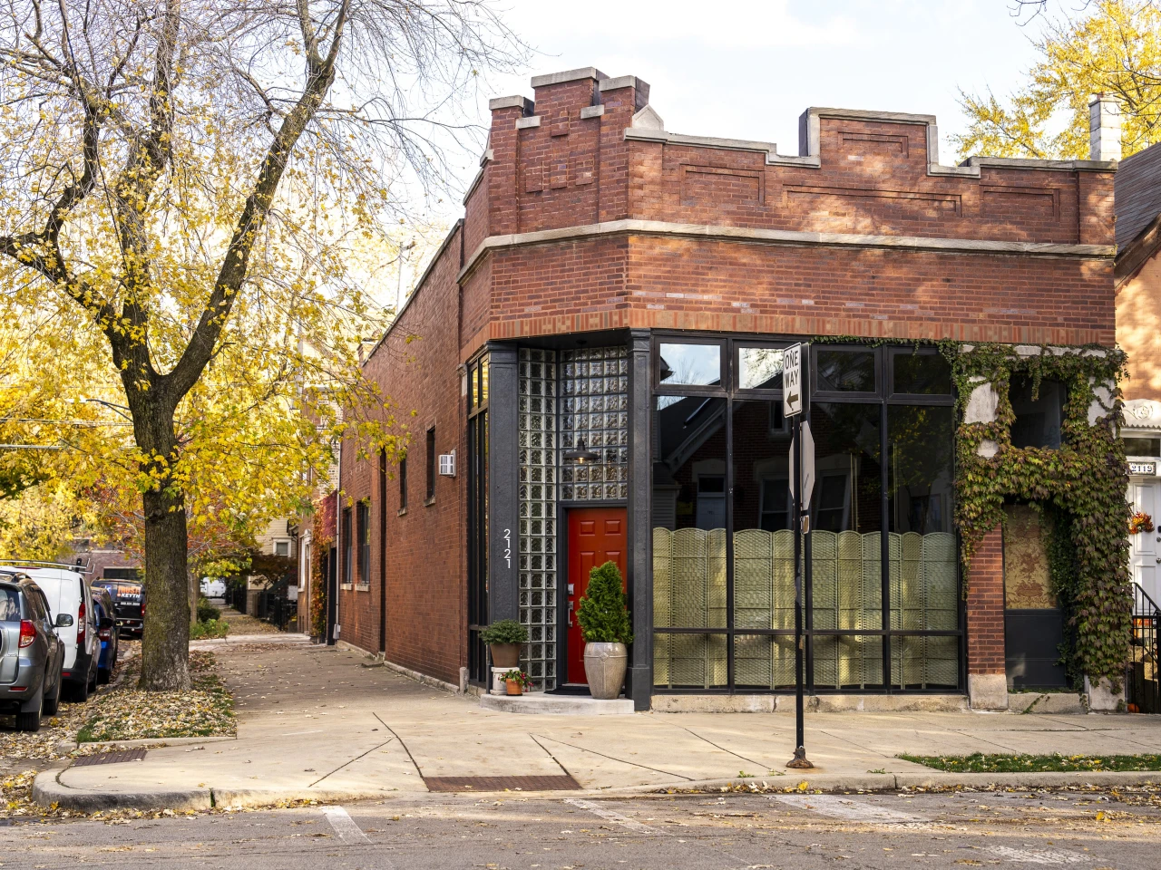 Small business owner unlocking the front door of a neighborhood storefront in Chicago early in the morning