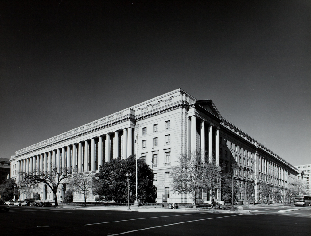 The exterior of the Internal Revenue Service headquarters building in Washington, DC, photographed on a clear daytime street scene
